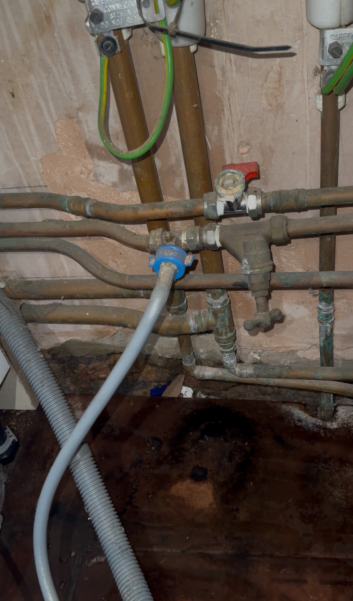 Before: Leaking washing machine hose replaced